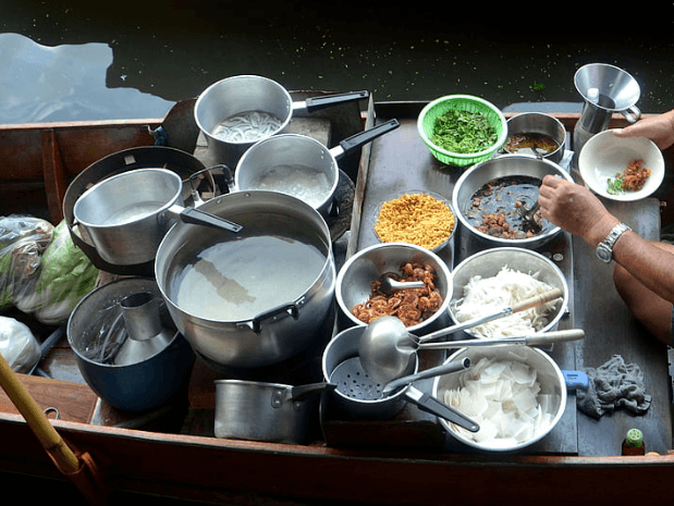 steelcookwarevsceramic food being selling in stainless steel cookware on the floating boat