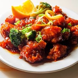 orange chicken plate on table